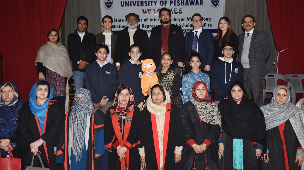 Minister of State for Interior Shehryar Afridi is posing for a group photo with Scholars' Cup representatives and faculty of University of Peshawar at Agha Khan auditorium on 22nd January, 2019